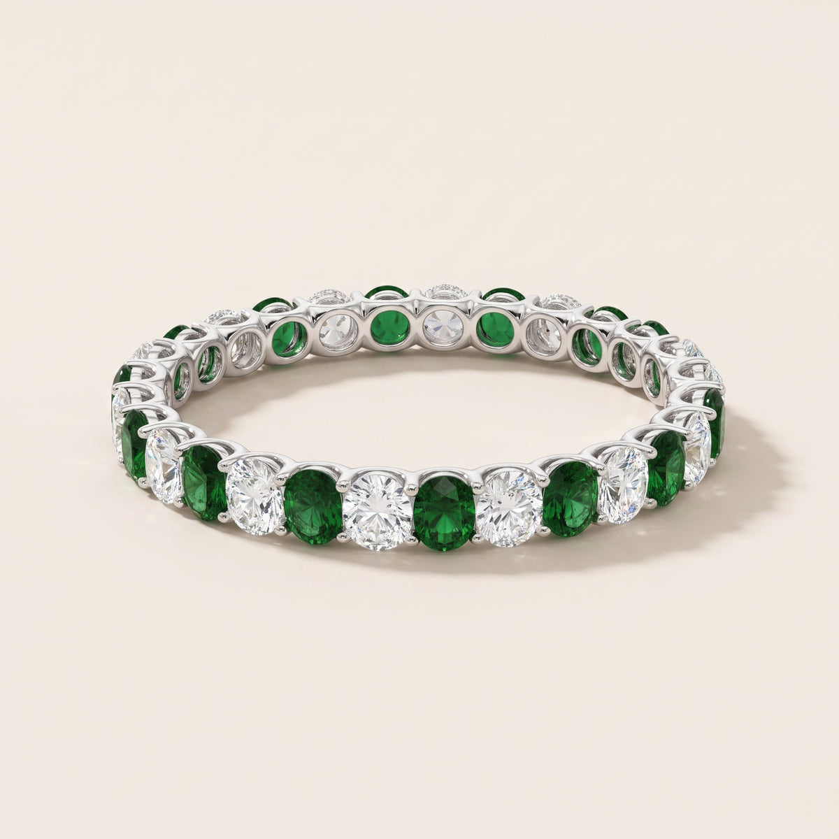 turn this into oval diamonds and oval emeralds rotating