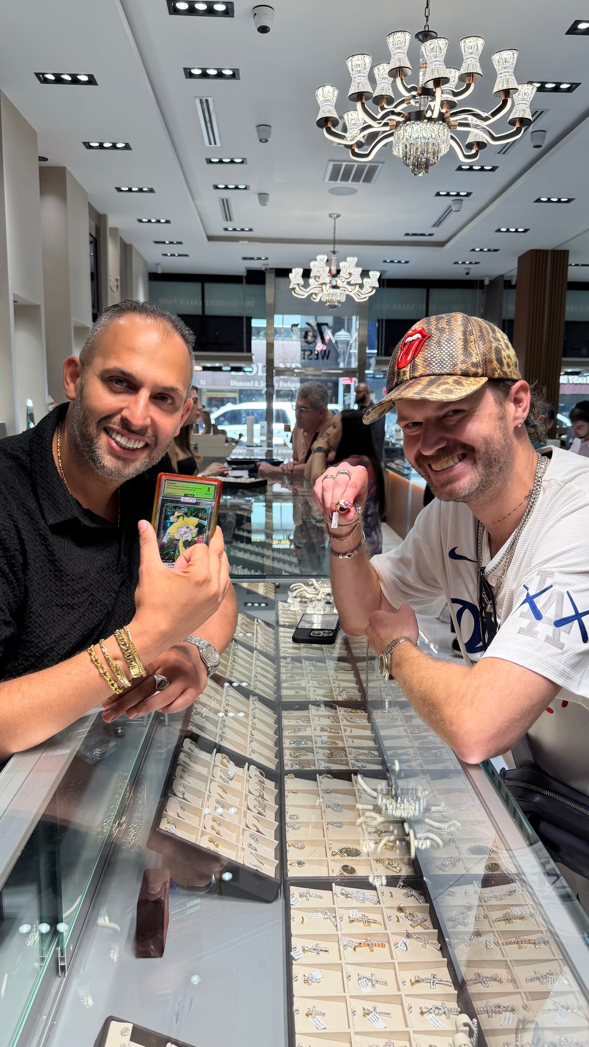 Benny and a customer at the Mazalito counter, 76 W 47th Street, the storefront behind them