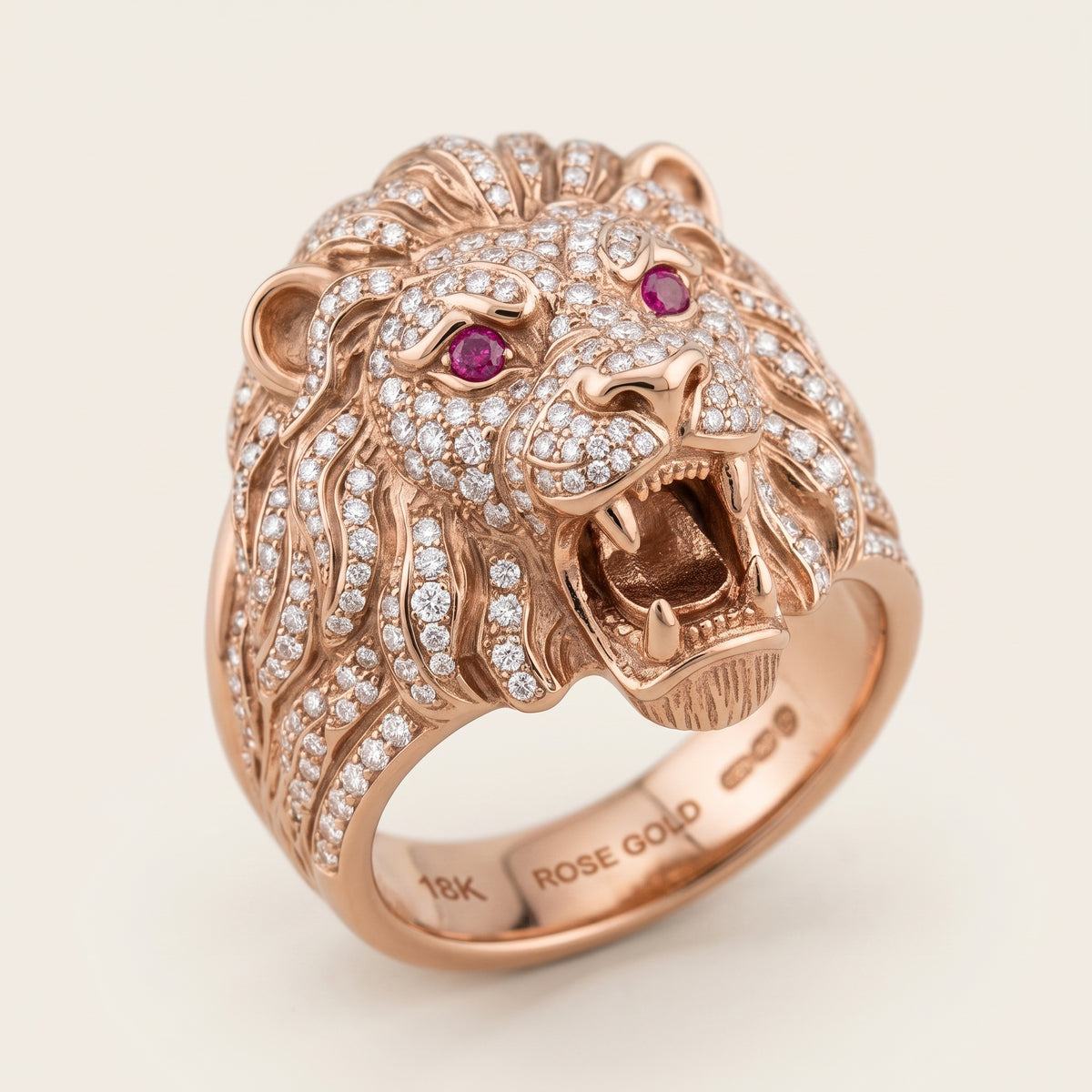 Rose gold mens ring of a Lions face with diamonds all around and ruby eyes